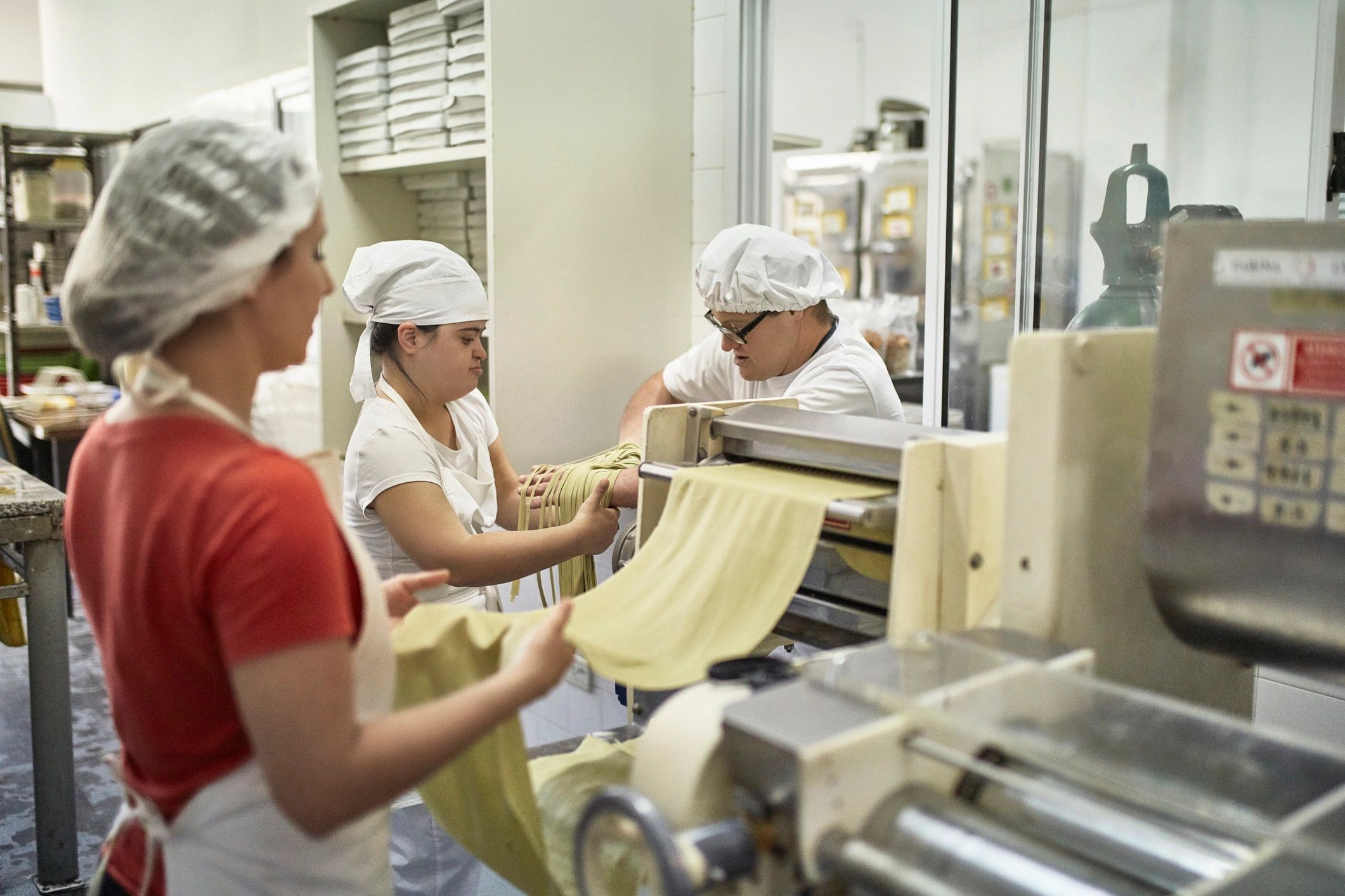 Manufacturing employees collaborating at work