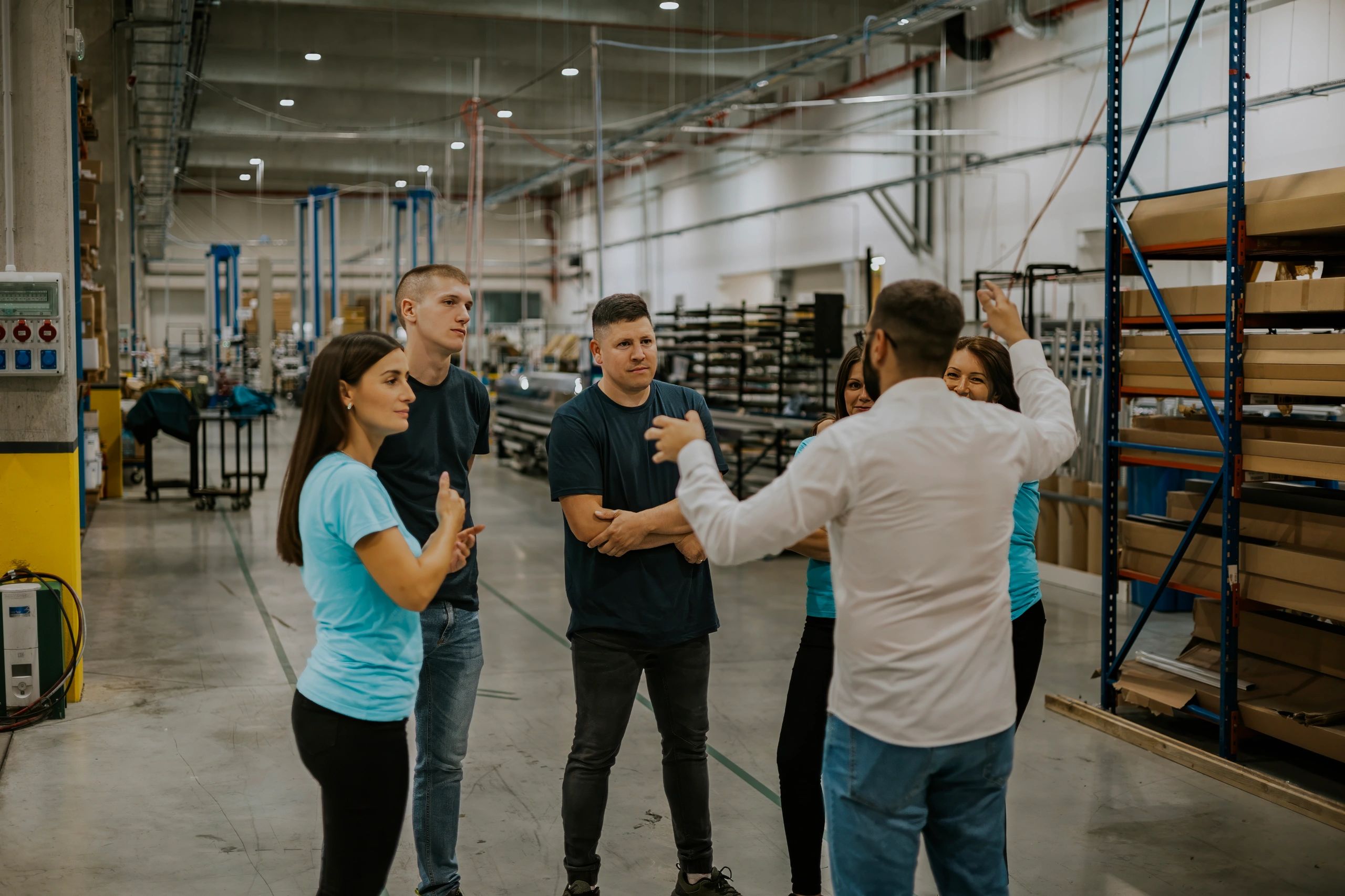 Manufacturing team discussing operations in an industrial facility